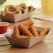 A Southern Champion paper food tray filled with fried food and a drink.