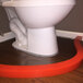 A white toilet with a red strip around the bottom.