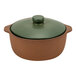 A brown and green Arcoroc Maria Portugal terracotta casserole dish with a lid.