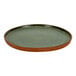 An Arcoroc Maria Portugal Terra green stoneware plate with a brown rim.