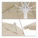 A close-up of a California Umbrella with a white pole and flax Sunbrella canopy.