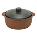 A brown and black Arcoroc Maria Portugal stoneware casserole dish with a black lid.