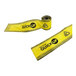 A yellow Quick Dam water barrier tape roll with black text.
