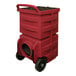 A red plastic Novatek air scrubber container with black holes and wheels.