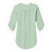 A back view of a women's Port Authority short sleeve blouse in misty sage.