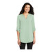 A woman wearing a Port Authority misty sage short sleeve blouse with a v-neck.