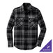 A gray and black plaid long sleeve flannel shirt with a logo on the chest.