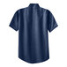 A Port & Company ink blue denim button-down shirt with a collar.