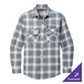 A close up of the pocket on a Port Authority long-sleeve plaid shirt in gray and white.