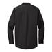 A black Port Authority dress shirt with long sleeves.