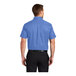 A man wearing an ultramarine blue Port Authority short sleeve dress shirt.