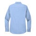 A Port Authority light blue long sleeved dress shirt for women.