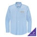A medium Brooks Brothers long sleeve light blue button up shirt with gold embroidery on the chest.