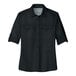 A black Port Authority short sleeve shirt for women with rolled up sleeves.