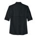 A Port Authority deep black short sleeve shirt for women.