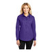 A woman wearing a Port Authority purple long sleeve dress shirt.