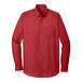 A Port Authority rich red long sleeve poplin shirt with a pocket.