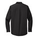 A Port Authority black long sleeve dress shirt.