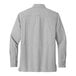 A long sleeved Port Authority gray shirt with buttons.