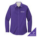A purple Port Authority long sleeve dress shirt on a counter with the logo of the company.