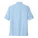 The back view of a light blue Port Authority long sleeve shirt.