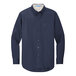 A Port Authority navy and light stone long sleeve button down dress shirt.