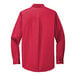 A Port Authority red and light stone dress shirt with long sleeves.