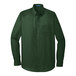 A Port Authority long sleeved deep forest green poplin dress shirt.