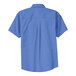 Port Authority ultramarine blue short sleeve dress shirt on a hanger.