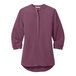 A purple Port Authority short sleeve blouse.