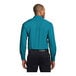 A man wearing a teal green Port Authority dress shirt.