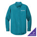 A teal Port Authority long sleeve dress shirt with a logo.