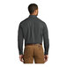 The back of a Port Authority long sleeve poplin dress shirt being worn by a man.