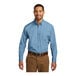 A man wearing a Port Authority long sleeve Carolina blue poplin dress shirt.