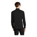 A man wearing a Mercer+Mettle black dress shirt with long sleeves.
