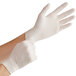 A person wearing Bluzen white powdered latex gloves.