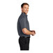 A man wearing a Port Authority steel gray short sleeve dress shirt with light stone accents.