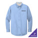 A medium long-sleeved light blue and light stone button-up dress shirt with the Port Authority logo on the cuff in light blue.