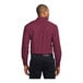 A man wearing a Port Authority burgundy and light stone long sleeve dress shirt.