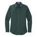 A Port Authority women's long sleeve dress shirt in dark green.