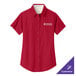 A red Port Authority women's dress shirt with white text on the chest.