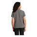 A woman wearing a Port Authority graphite short sleeve staff shirt.