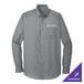 A Port Authority long sleeved grey button up shirt.