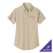 A tan Port Authority short sleeve shirt with gold embroidery.