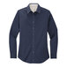 A Port Authority women's long sleeve navy dress shirt.