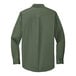 A Port Authority clover green long sleeve dress shirt.