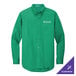 A Port Authority court green long sleeve dress shirt with a company logo.