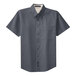 A Port Authority steel gray and light stone men's short sleeve button-down shirt.