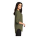 A woman wearing a Port Authority deep olive green short sleeve blouse.