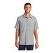 A man wearing a Port Authority short sleeved shirt in gusty gray with a UPF rating of 30.